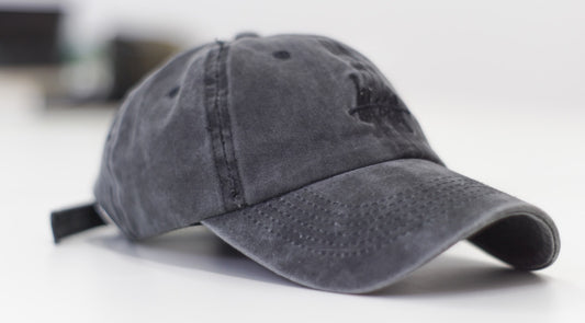 Close-up of a black baseball cap.